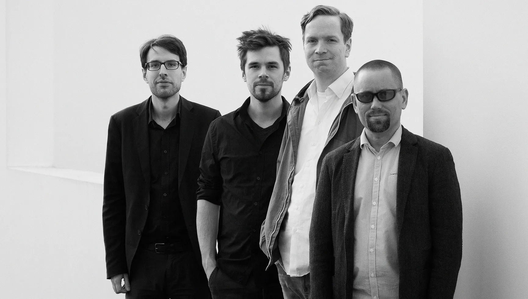 Foto des Quartetts, schwarz-weiß.